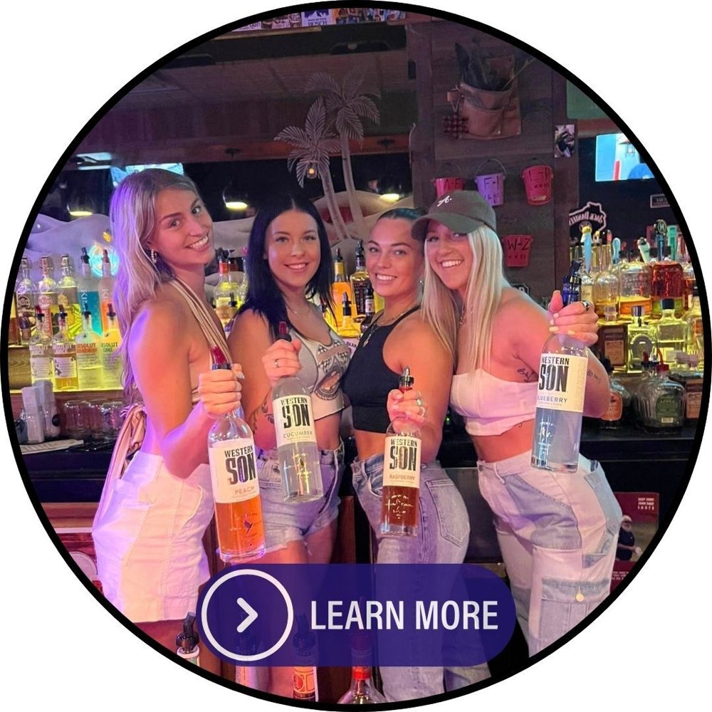 The Black Saddle bar crew behind the bar